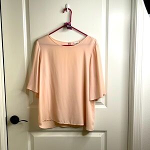 Light pink blouse.